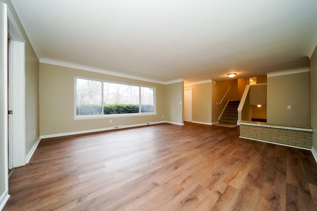 unfurnished living room with hardwood / wood-style floors