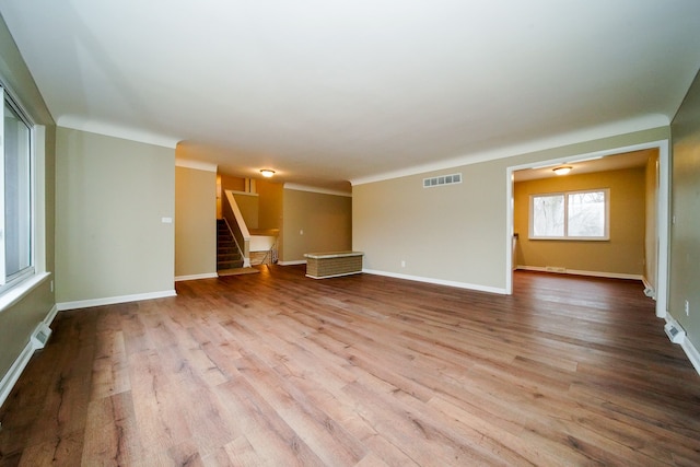 unfurnished living room featuring light hardwood / wood-style flooring