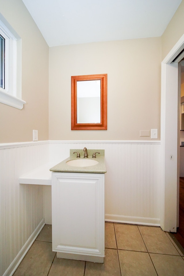 bathroom with tile patterned floors and vanity