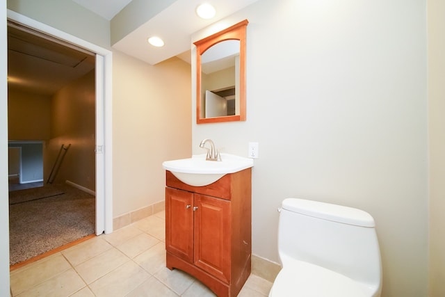 bathroom with tile patterned floors, vanity, and toilet