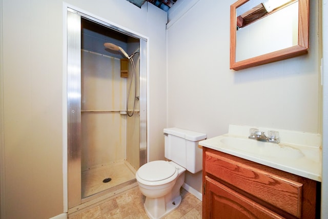 bathroom featuring vanity, toilet, and a shower