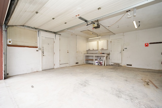 garage featuring a garage door opener