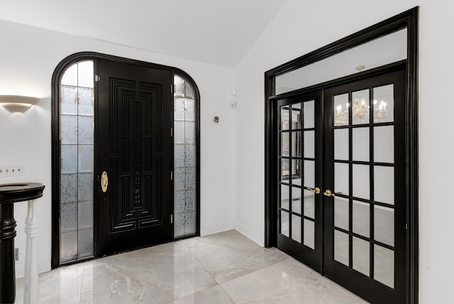 entryway with french doors and lofted ceiling