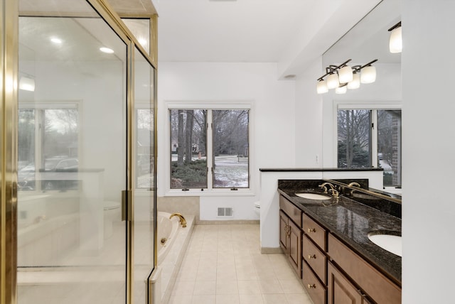 full bathroom with tile patterned flooring, toilet, vanity, and shower with separate bathtub