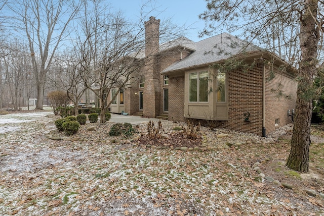 view of property exterior featuring a patio