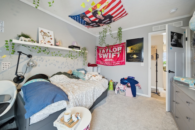 carpeted bedroom with ornamental molding