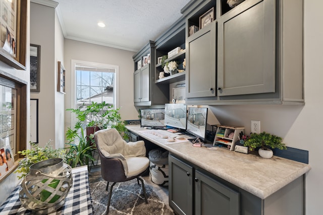 office featuring crown molding and a textured ceiling