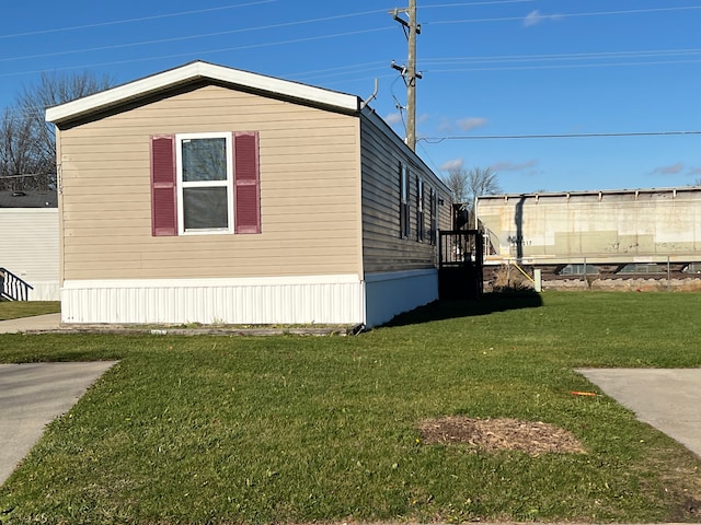 view of property exterior featuring a yard