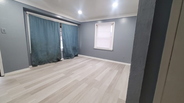 spare room featuring light wood-type flooring