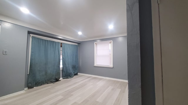 unfurnished room featuring light hardwood / wood-style floors