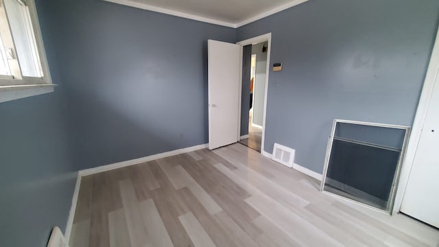 spare room featuring light hardwood / wood-style flooring