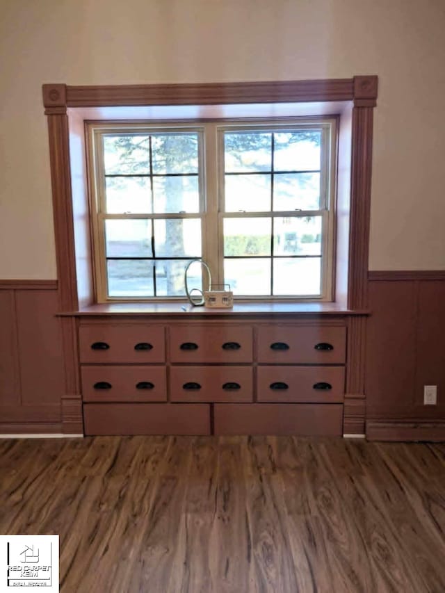 room details with hardwood / wood-style floors and a baseboard heating unit