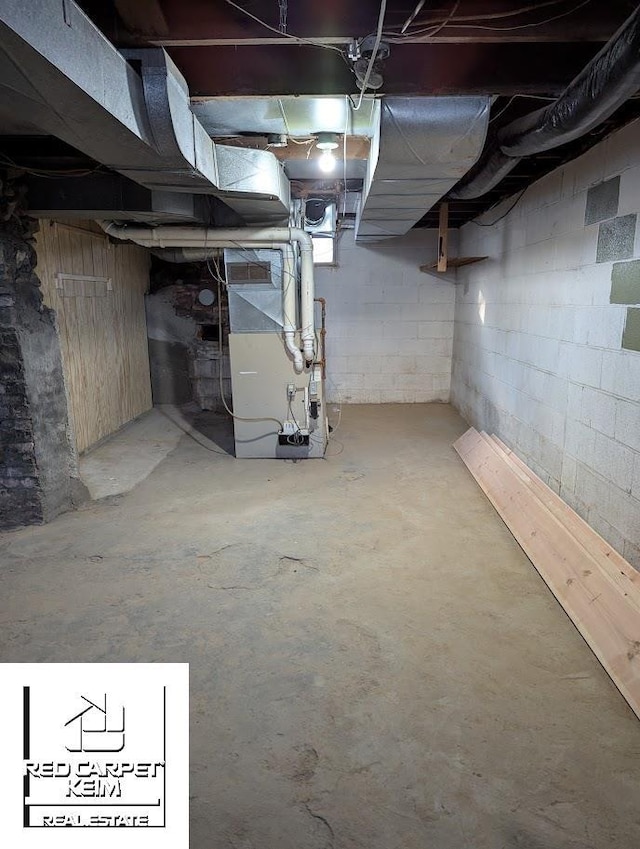 basement featuring heating unit