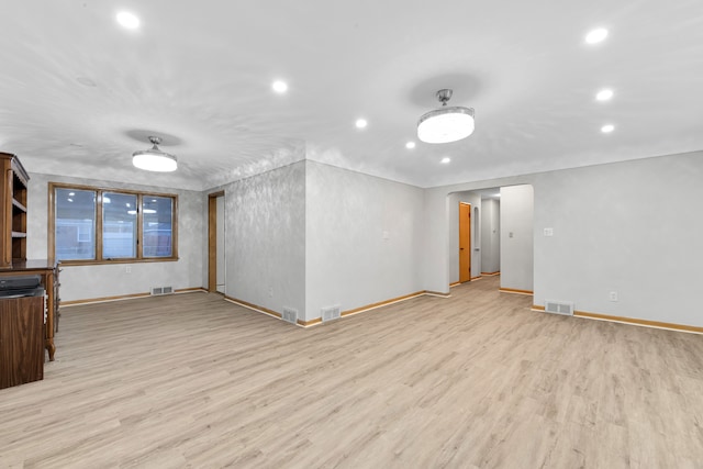 unfurnished living room featuring light wood-type flooring