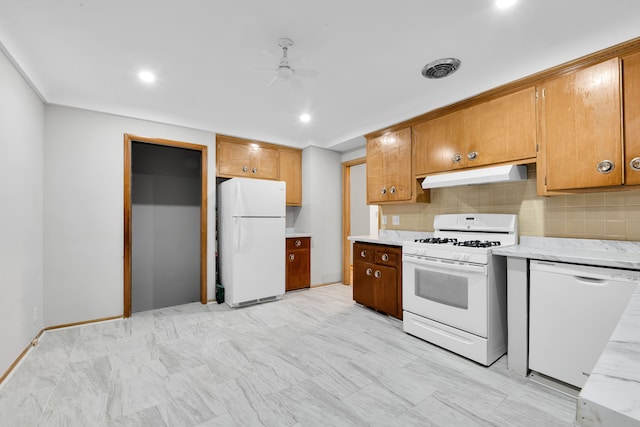 kitchen featuring tasteful backsplash, ceiling fan, and white appliances