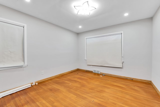 spare room featuring hardwood / wood-style flooring