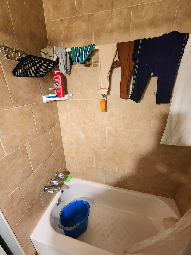 bathroom featuring separate shower and tub