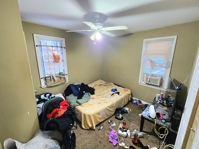 carpeted bedroom with ceiling fan and cooling unit