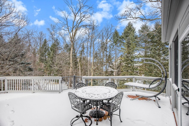 view of snow covered deck