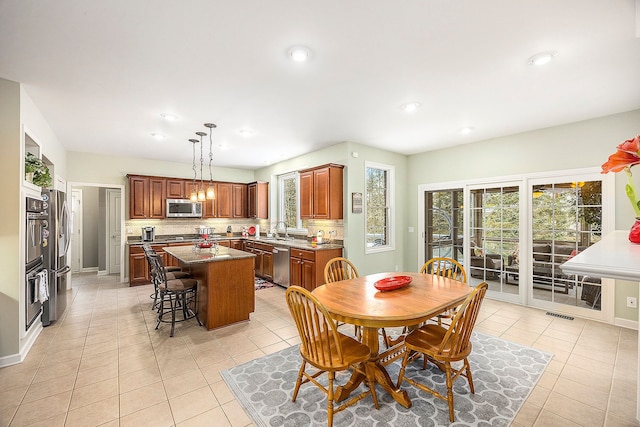 tiled dining space with sink