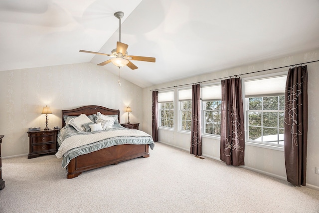 bedroom featuring a ceiling fan, baseboards, carpet, and lofted ceiling
