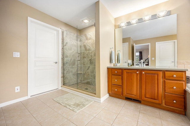 bathroom featuring tile patterned flooring, vanity, and an enclosed shower