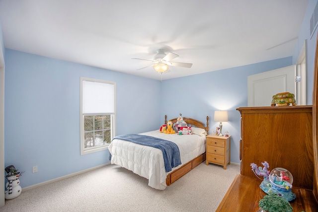 carpeted bedroom featuring ceiling fan and baseboards