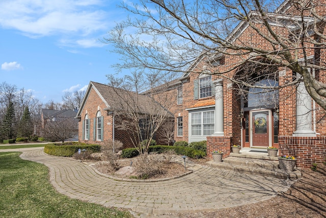 exterior space with brick siding
