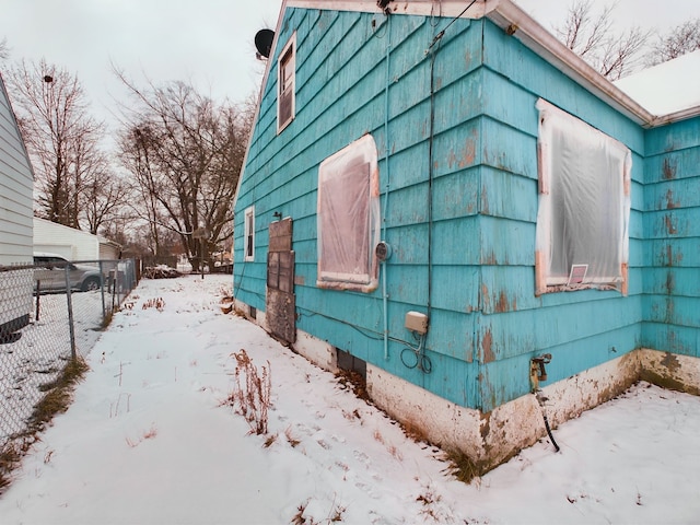 view of snow covered property