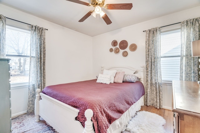 bedroom featuring ceiling fan and light wood-type flooring