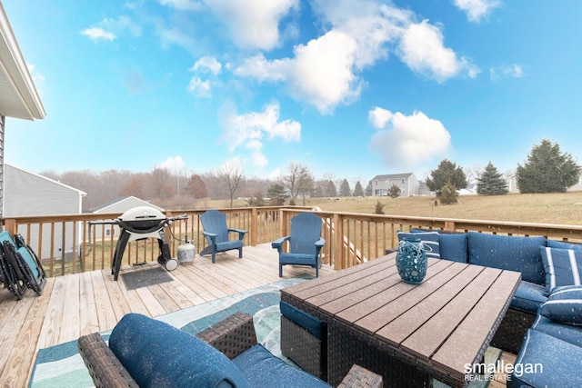 wooden deck with outdoor dining area and area for grilling