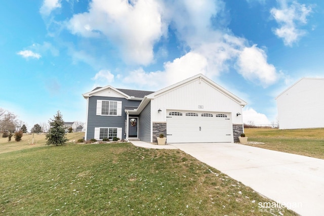 view of front of house featuring stone siding, a garage, driveway, and a front yard