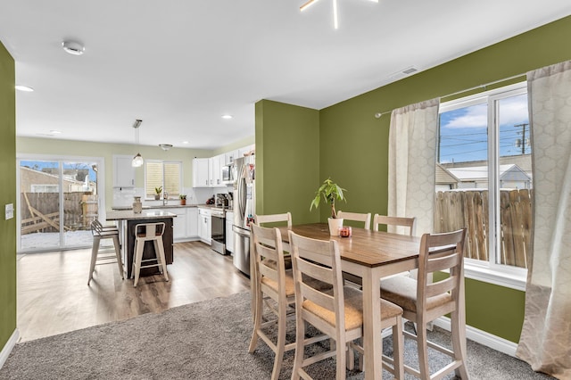 dining room featuring light wood-type flooring