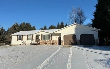 ranch-style house featuring a garage