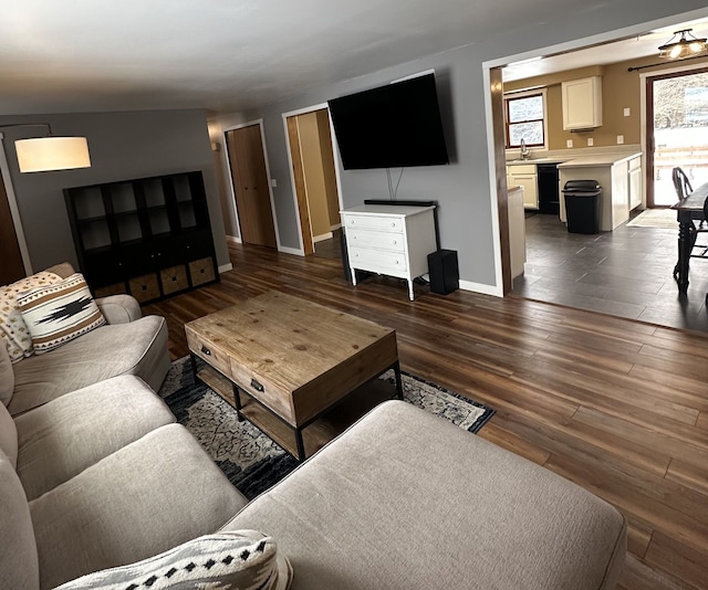 living area featuring dark wood-style floors and baseboards