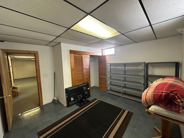 bedroom featuring a paneled ceiling and a closet