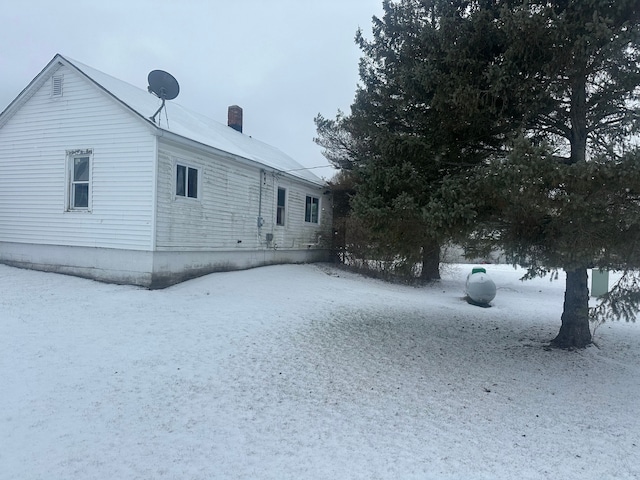 view of snow covered property