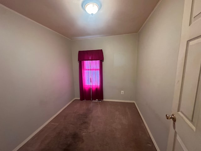 carpeted spare room with crown molding