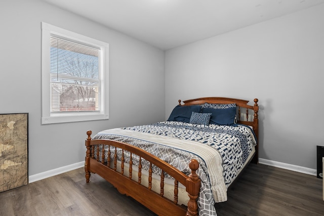 bedroom with dark wood-type flooring