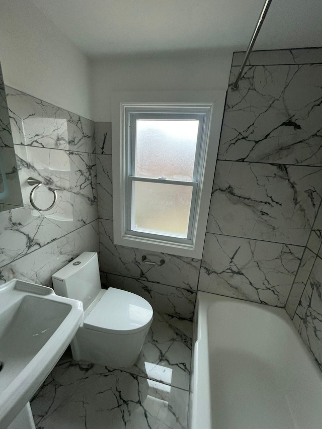 full bathroom featuring tub / shower combination, toilet, and sink