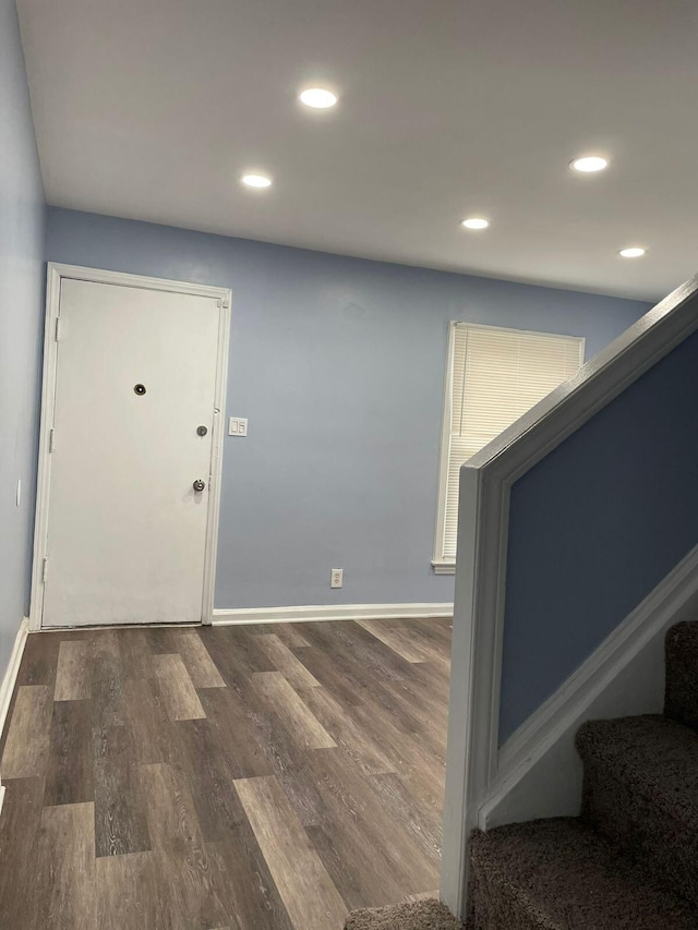 entrance foyer with dark hardwood / wood-style floors