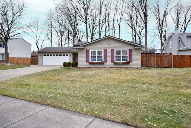 view of front of home featuring a garage and a front lawn