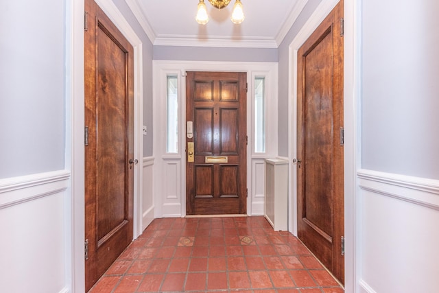 entryway featuring crown molding