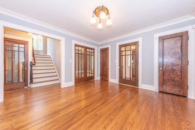 interior space featuring hardwood / wood-style flooring and ornamental molding