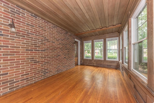 unfurnished sunroom with wood ceiling