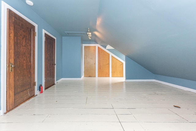 bonus room featuring lofted ceiling