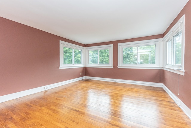 unfurnished room featuring light hardwood / wood-style floors