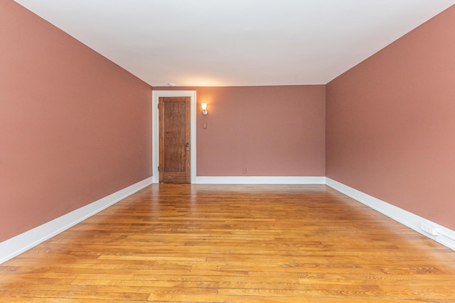 spare room featuring light hardwood / wood-style flooring