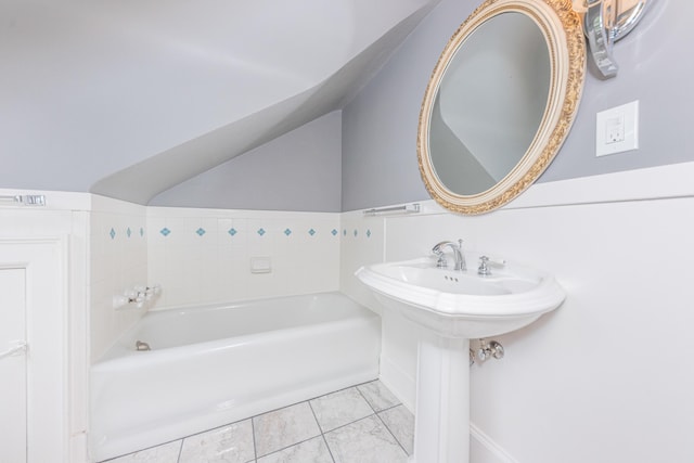 bathroom featuring a washtub