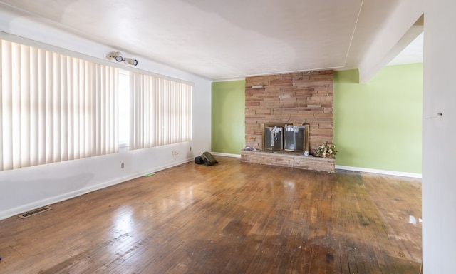 unfurnished living room featuring wood-type flooring